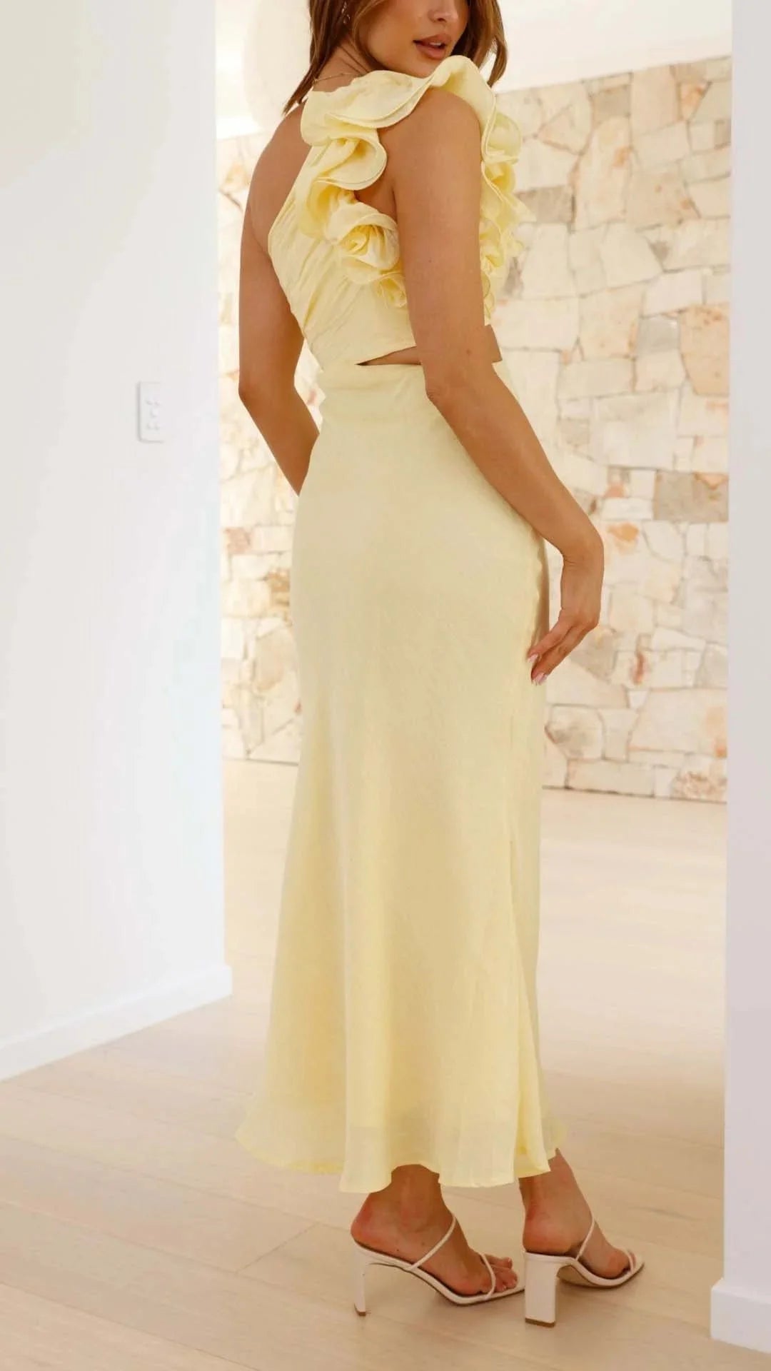"Women’s yellow maxi dress featuring floral shoulder design in a breezy fabric suitable for casual wear or special…