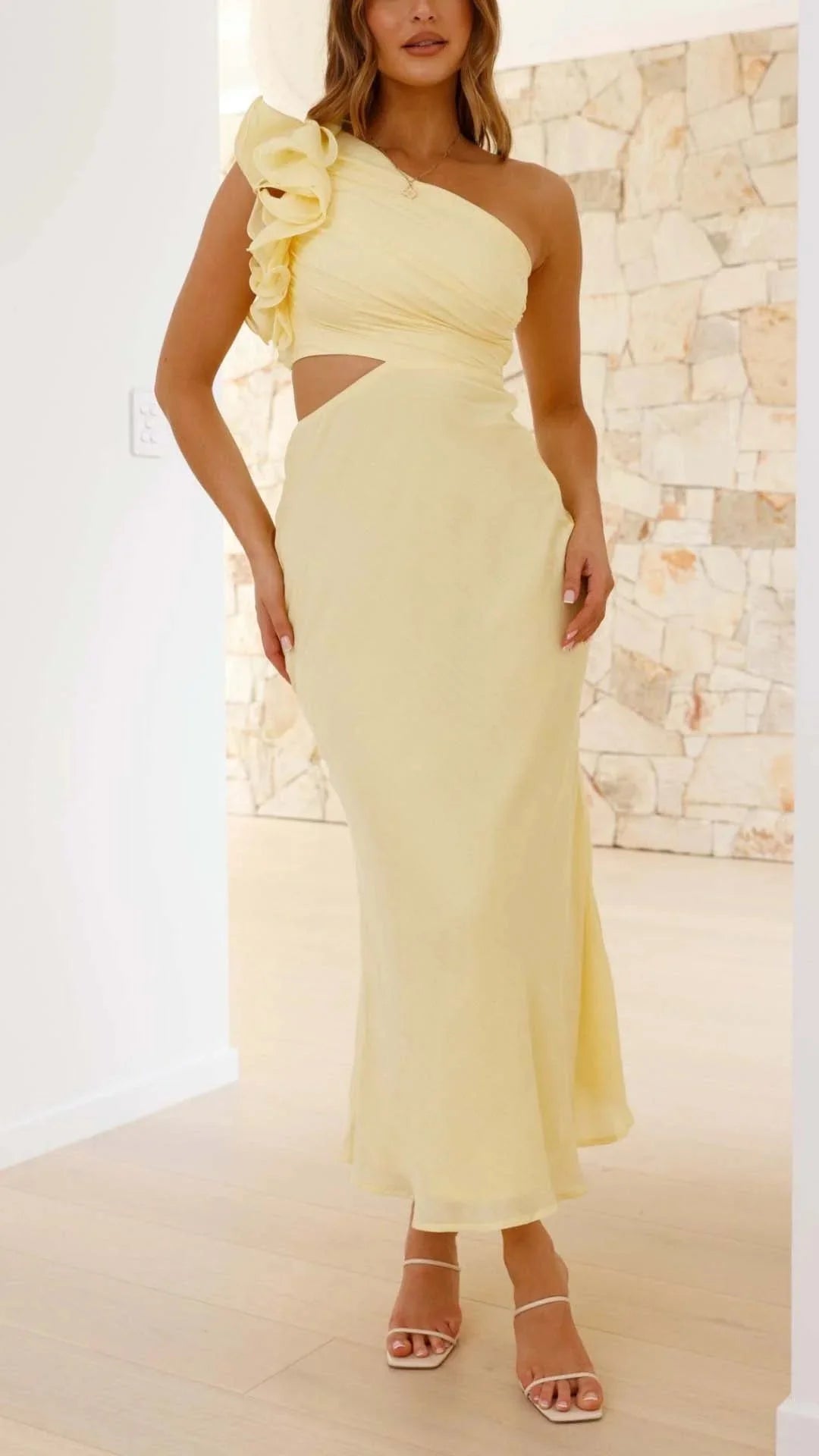 "Yellow maxi dress with floral shoulder detail for women, perfect for summer adventures, made from soft and breathable…