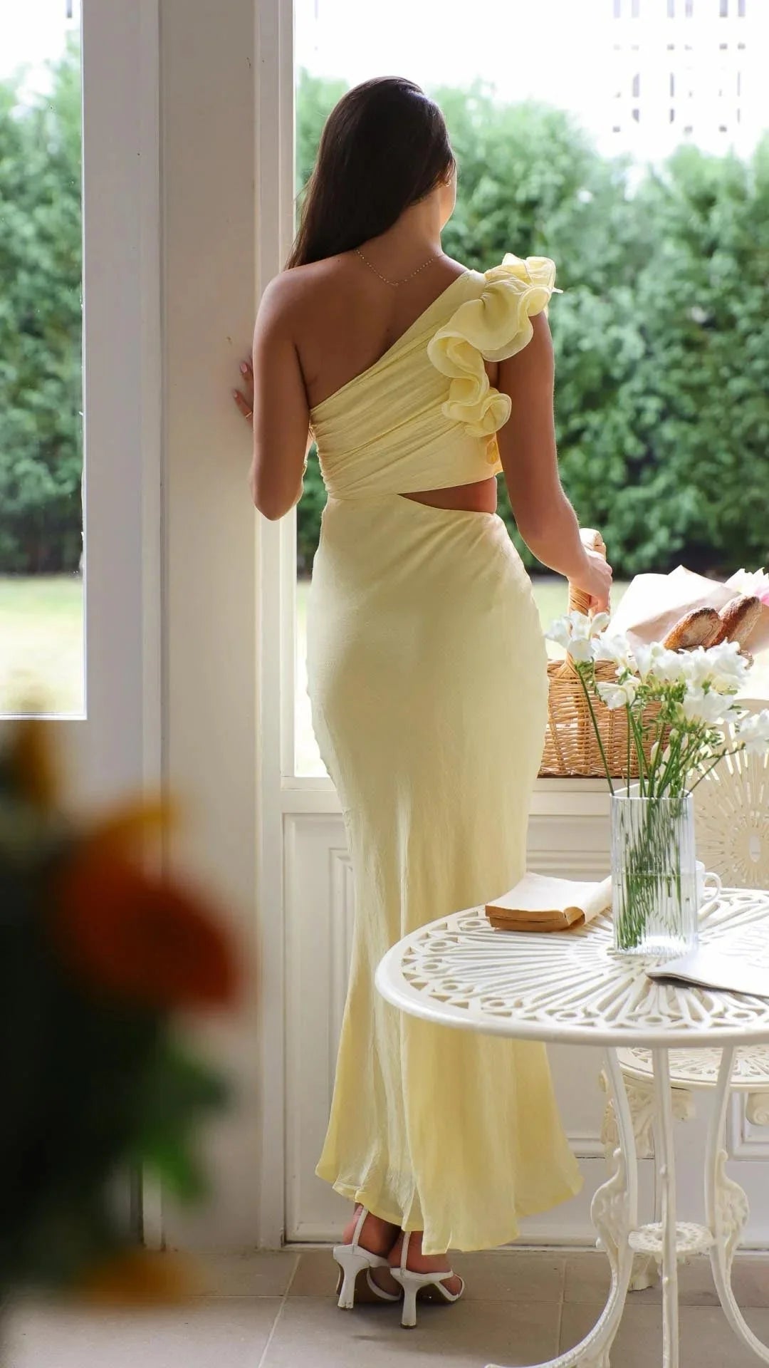 "Yellow maxi dress with floral shoulder detailing for women, made from lightweight and breathable fabric for comfortable…