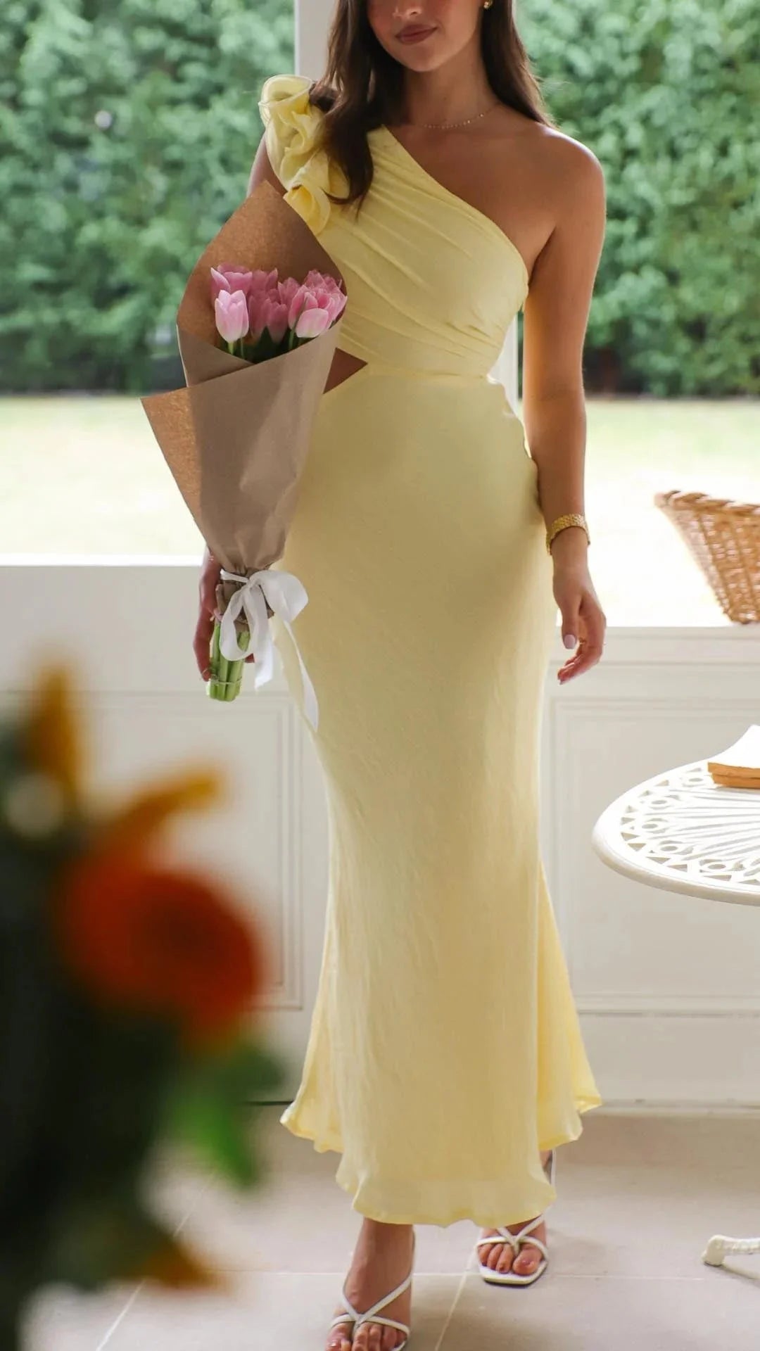 "Yellow maxi dress with floral shoulder design for women, made from lightweight and flowy fabric."