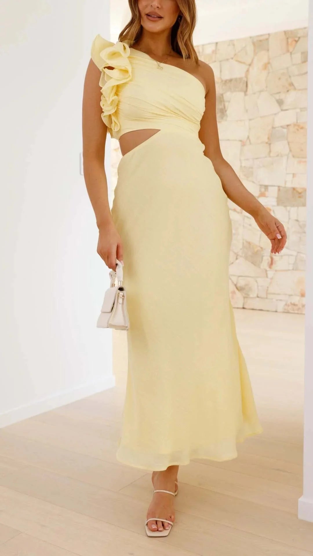 Women's yellow maxi dress with floral shoulder detail, soft and breathable fabric, perfect for a casual yet stylish summer…