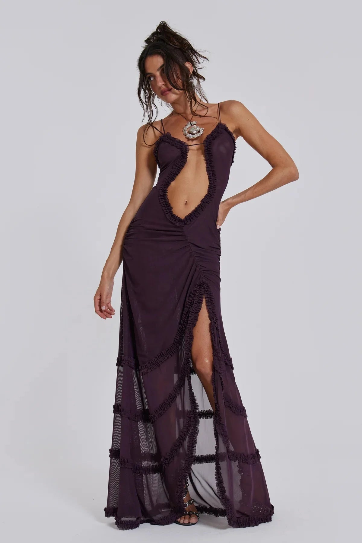 "Jazlyn maxi dress in artistic design with plunging neckline, made of soft and flowing material."