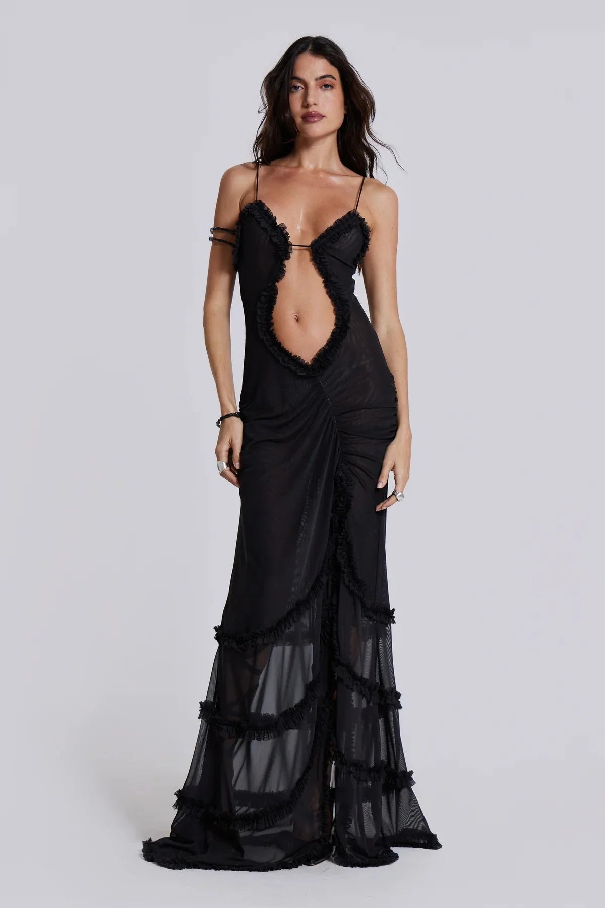 Black maxi dress with plunging bustline featuring artistic design. Made from soft, flowy fabric for a comfortable and…