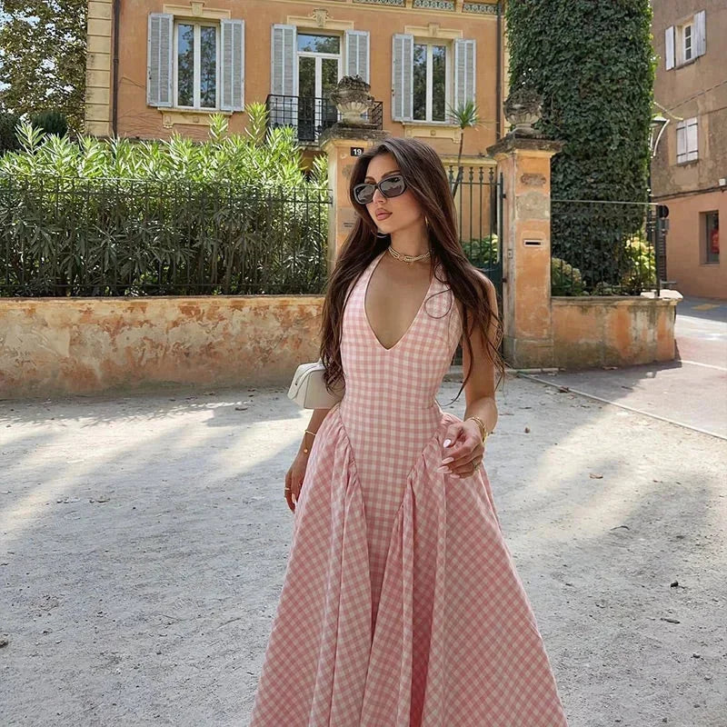 Sleeveless pink plaid midi dress made with soft cotton blend fabric, featuring convenient pockets.