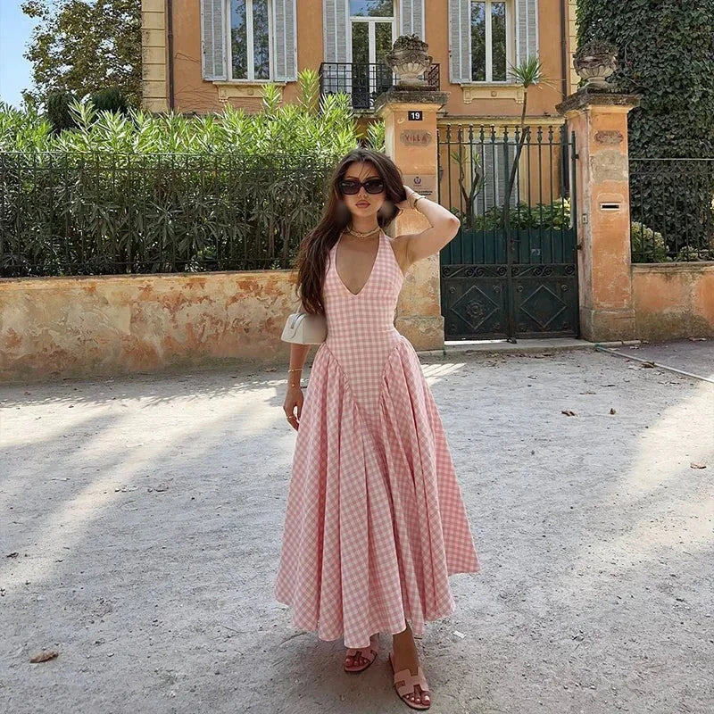 Sleeveless pink plaid midi dress with pockets made of lightweight cotton, perfect for summer outings or casual events.