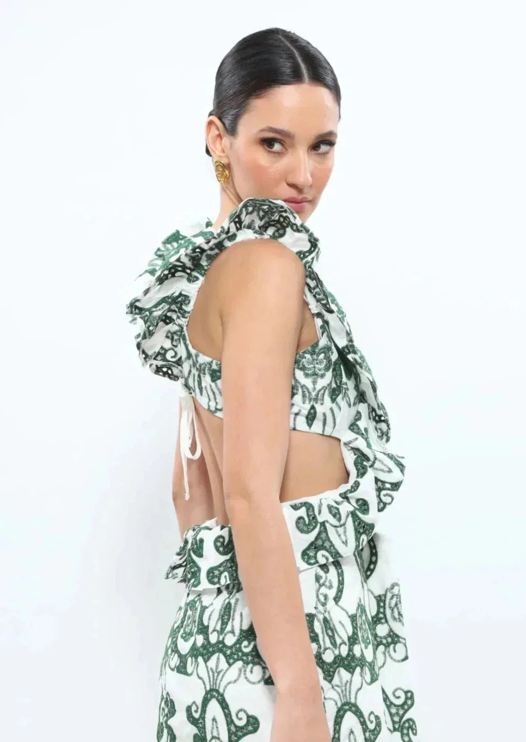 White and green ruffled maxi dress made of lightweight linen blend fabric with a flattering design for a chic summer…