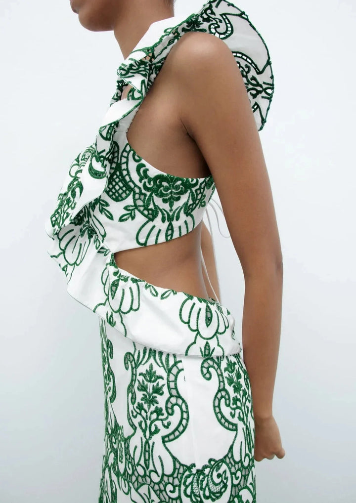 "White and green ruffled maxi dress made from lightweight cotton blend, perfect for summer days and casual outings."