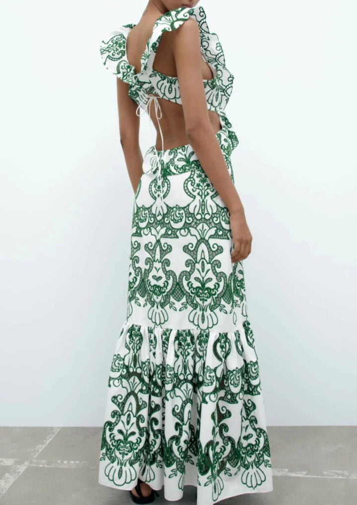 White and green ruffled maxi dress in a soft, flowy fabric with a delicate floral print, perfect for a casual spring day out.
