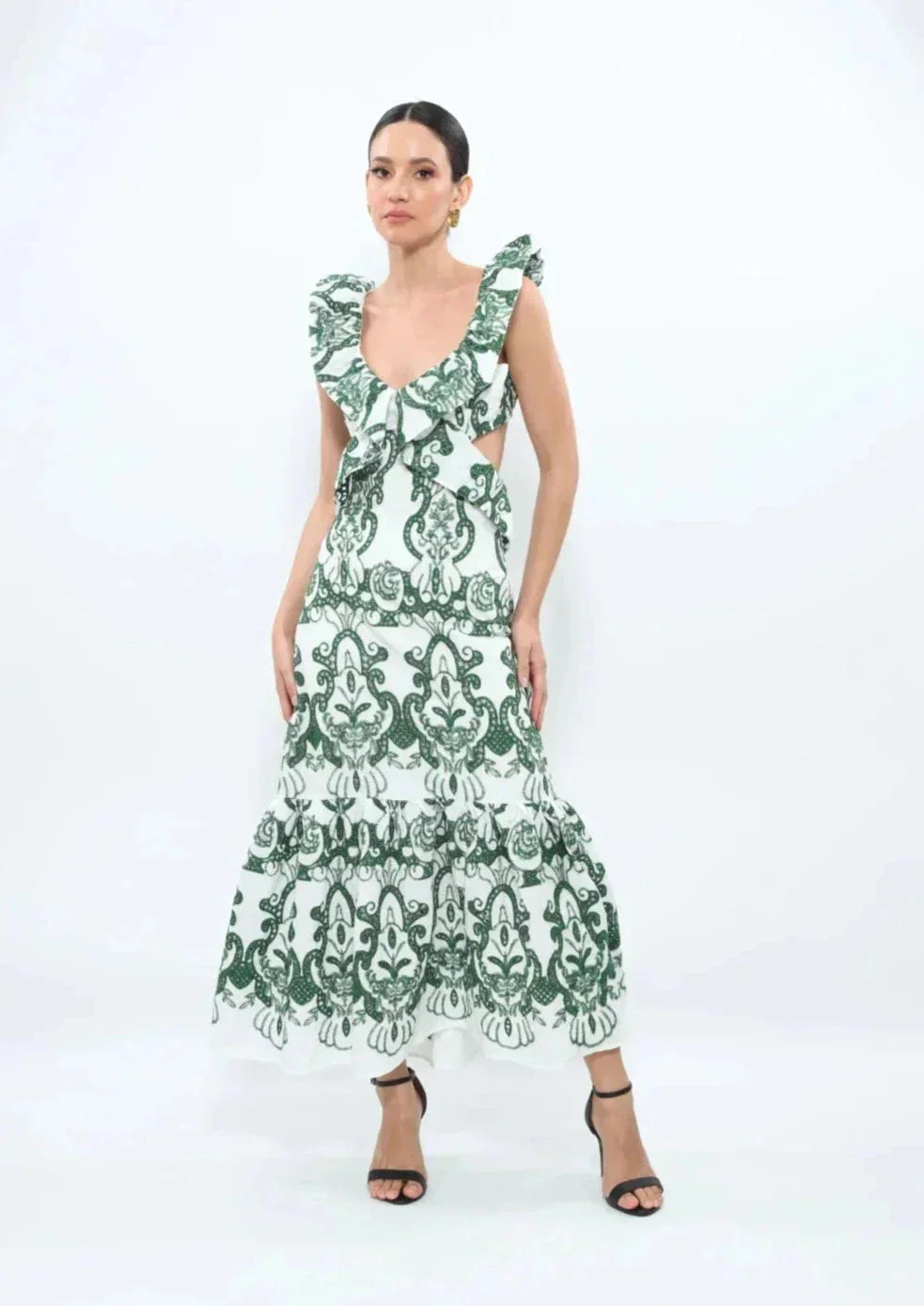 White and green ruffled maxi dress made from lightweight and flowy fabric, perfect for a summery and feminine look.