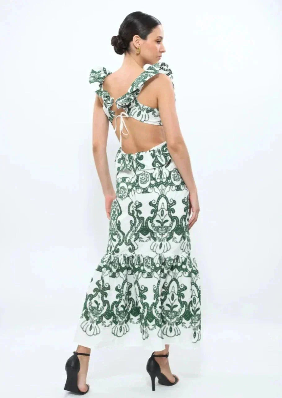 "White and green ruffled maxi dress with a flowy design, perfect for a summer day out."