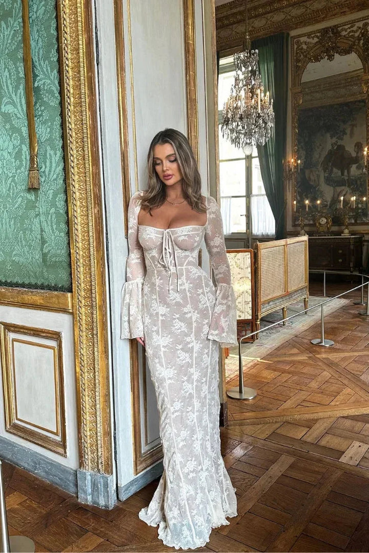 "Women's white lace off-shoulder dress with long sleeves, elegant design."