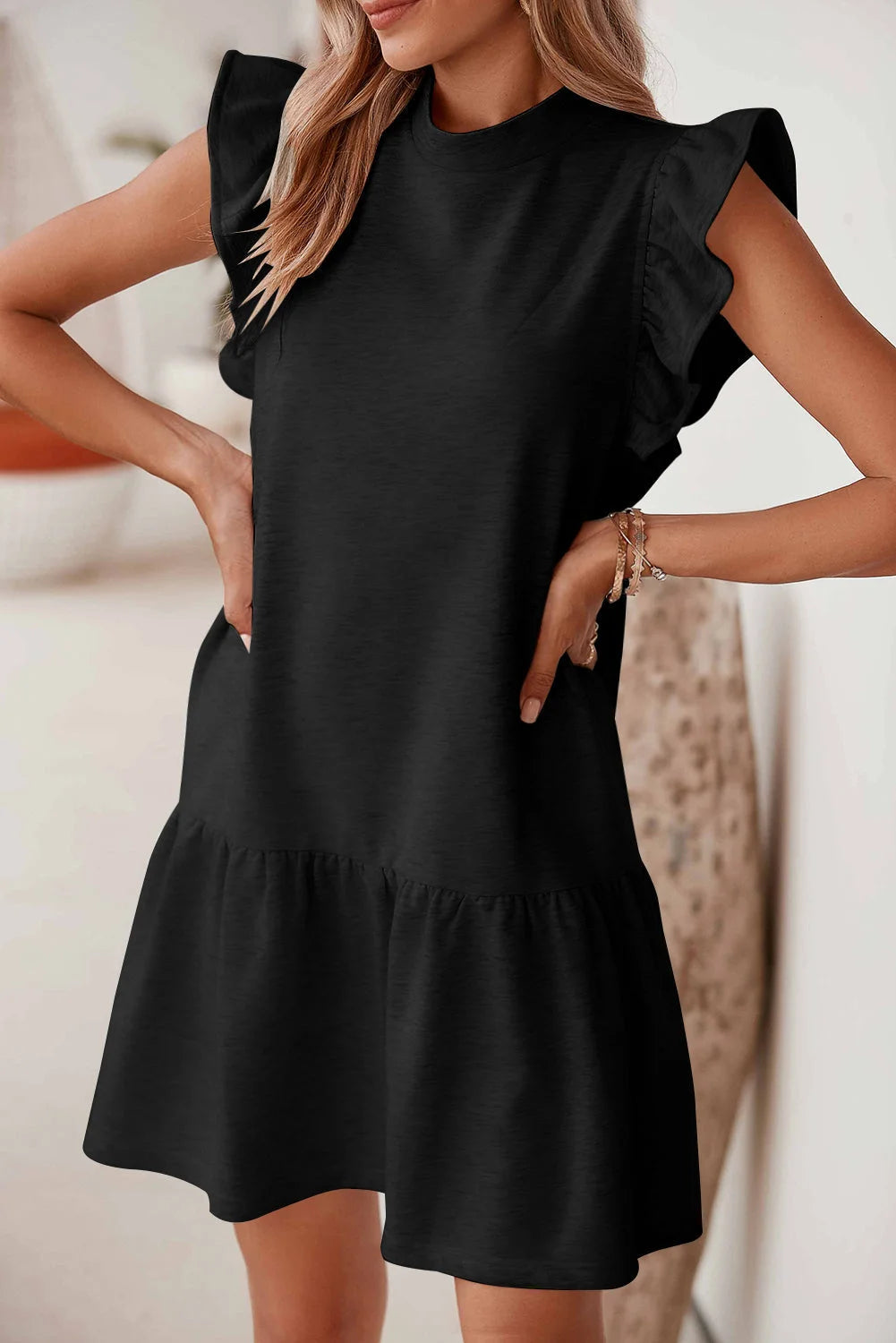 Black shift dress with ruffle sleeves in Jordan style. Made from lightweight cotton blend, perfect for a casual yet stylish…