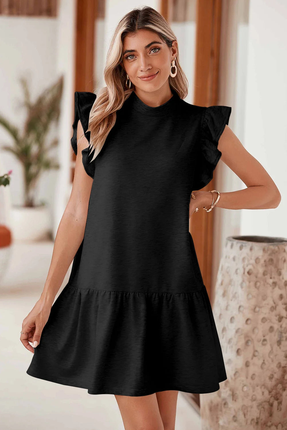 "Black shift dress with ruffle sleeves by Jordan, versatile and elegant choice for any occasion"