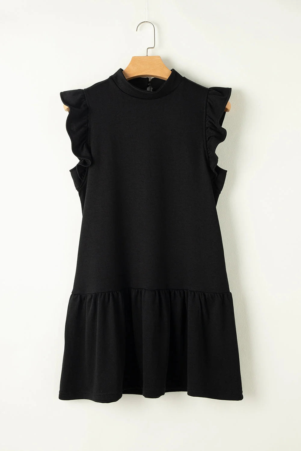 "Black shift dress with stylish ruffle sleeves by Jordan, perfect for a chic and sophisticated look."