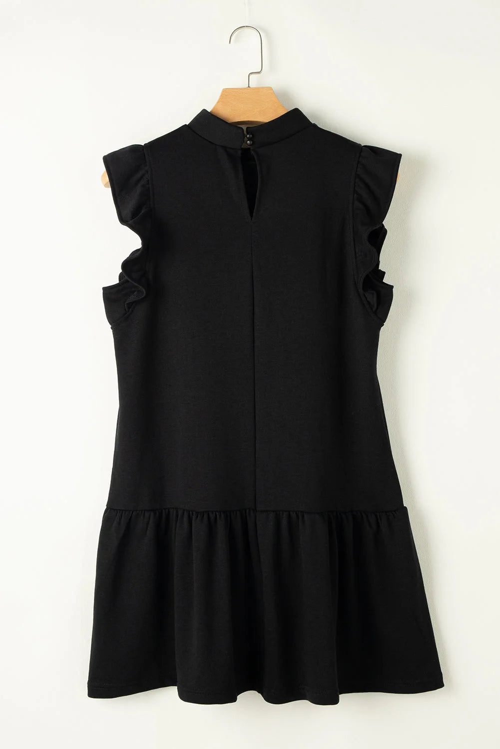 Black shift dress with elegant ruffle sleeves, from Jordan. Simple yet chic design, perfect for any occasion.