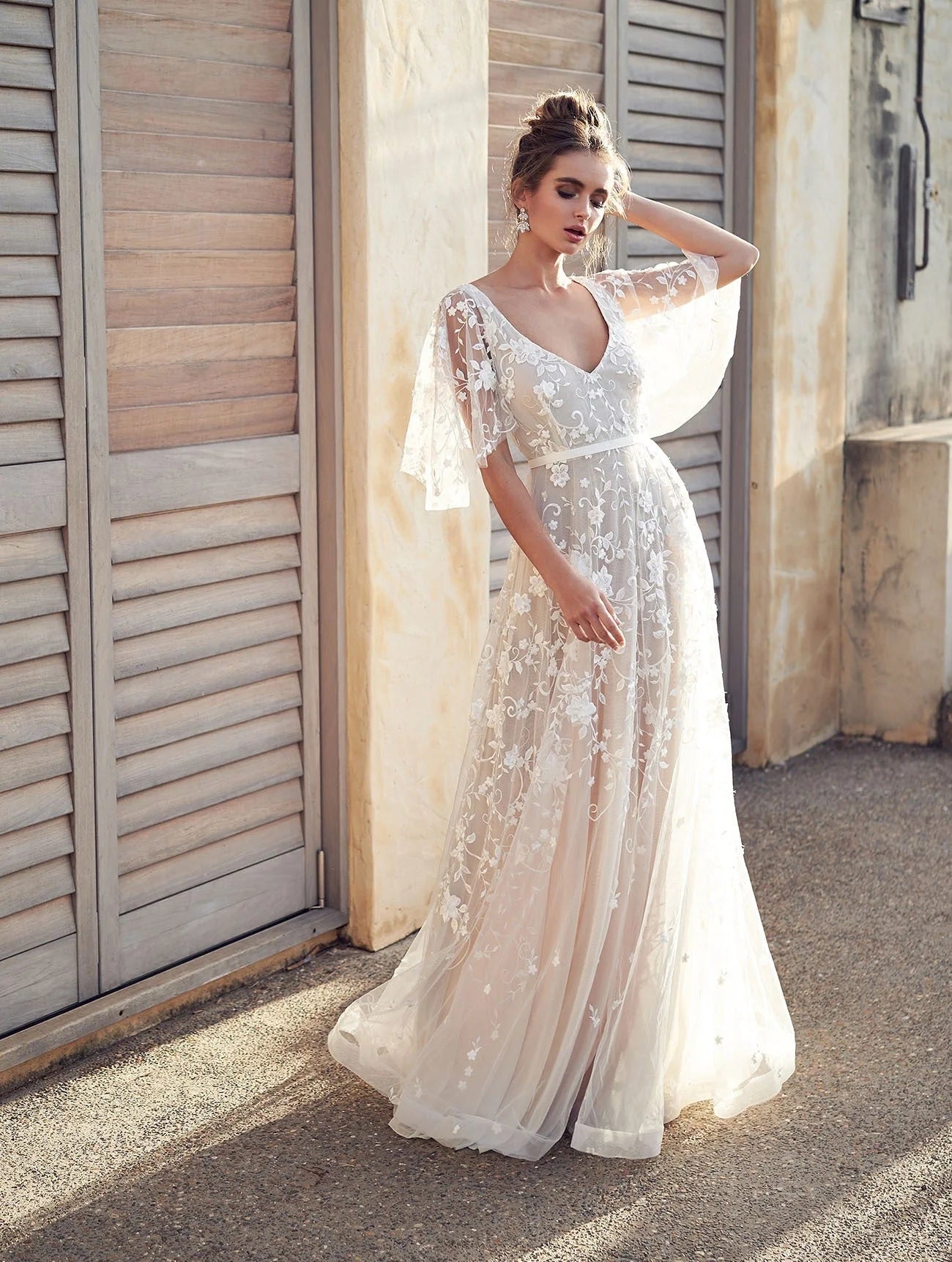 "Ivory maxi dress featuring intricate floral embroidery, perfect for a sophisticated and elegant look."