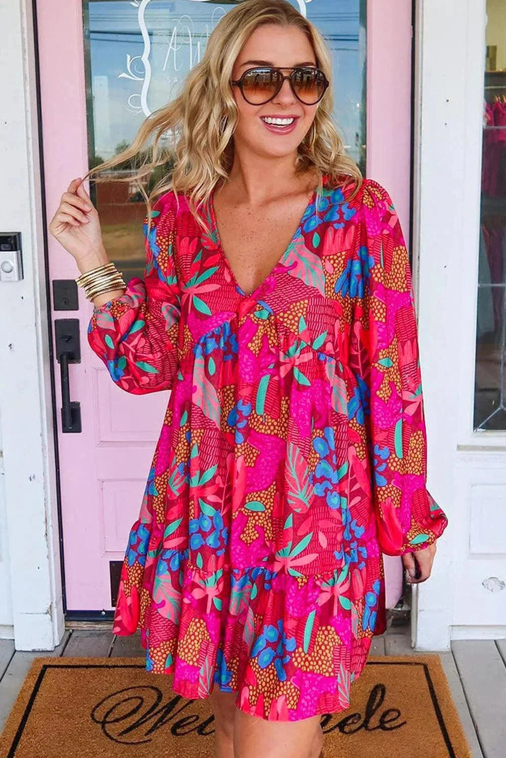 "Kaileigh Women's floral bell-sleeved V-neck dress in light, flowy fabric with vibrant floral print, perfect for a chic and…