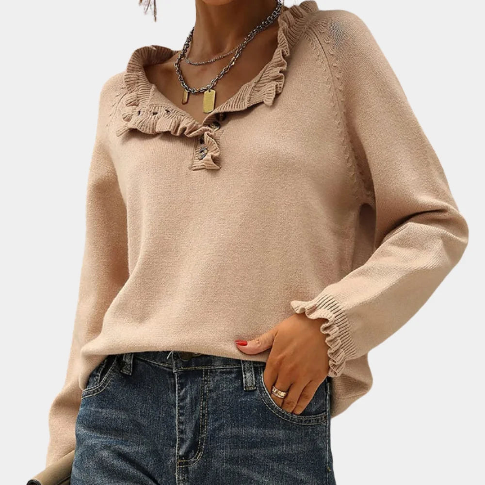 "Beige long sleeve pullover with ruffle collar, made of soft knit fabric for cozy and stylish winter look."