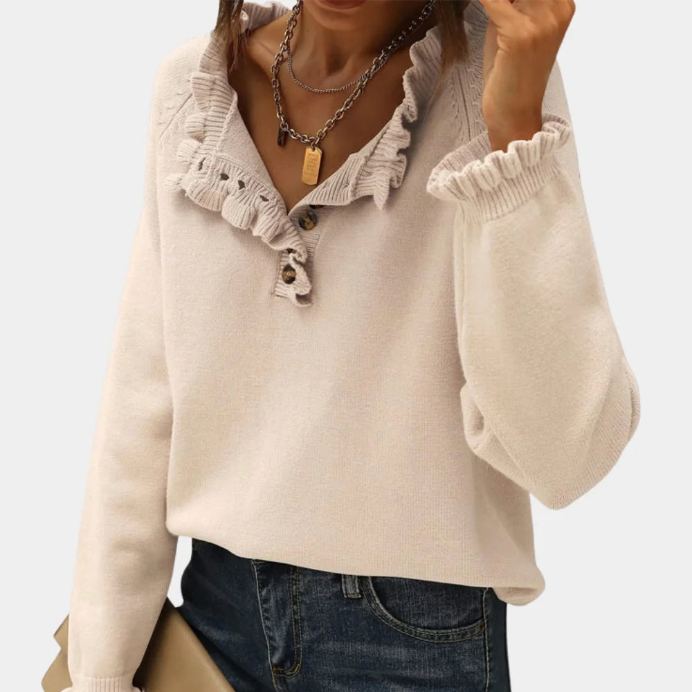 Cream long sleeve pullover with ruffle collar, cozy texture, and relaxed fit.