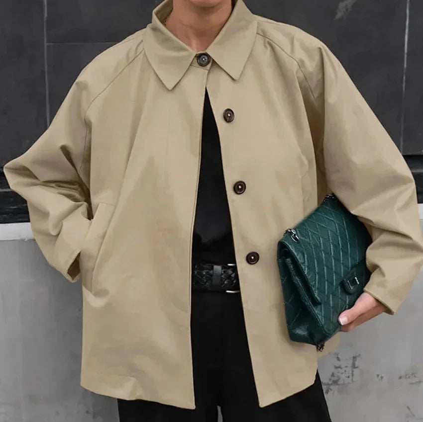 "Khaki oversized jacket with front buttons, made of soft, cozy material. Stylish design for a comfortable and trendy look."