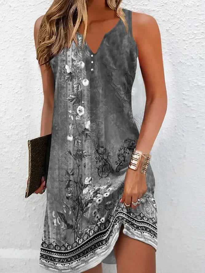 "Sleeveless grey boho dress with delicate floral pattern. Soft and flowy material perfect for effortless style."