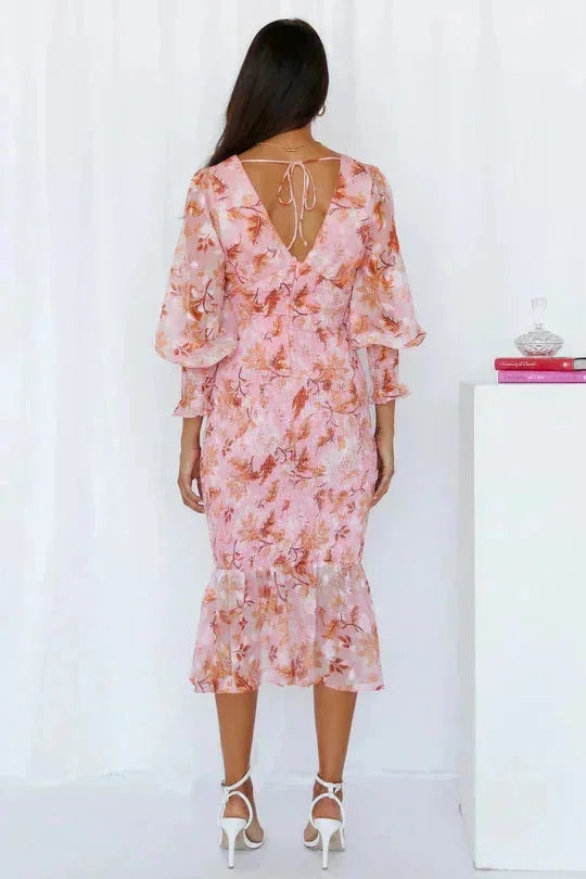 "Floral midi dress with flared sleeves in a lightweight fabric, featuring a vibrant floral print perfect for a stylish and…