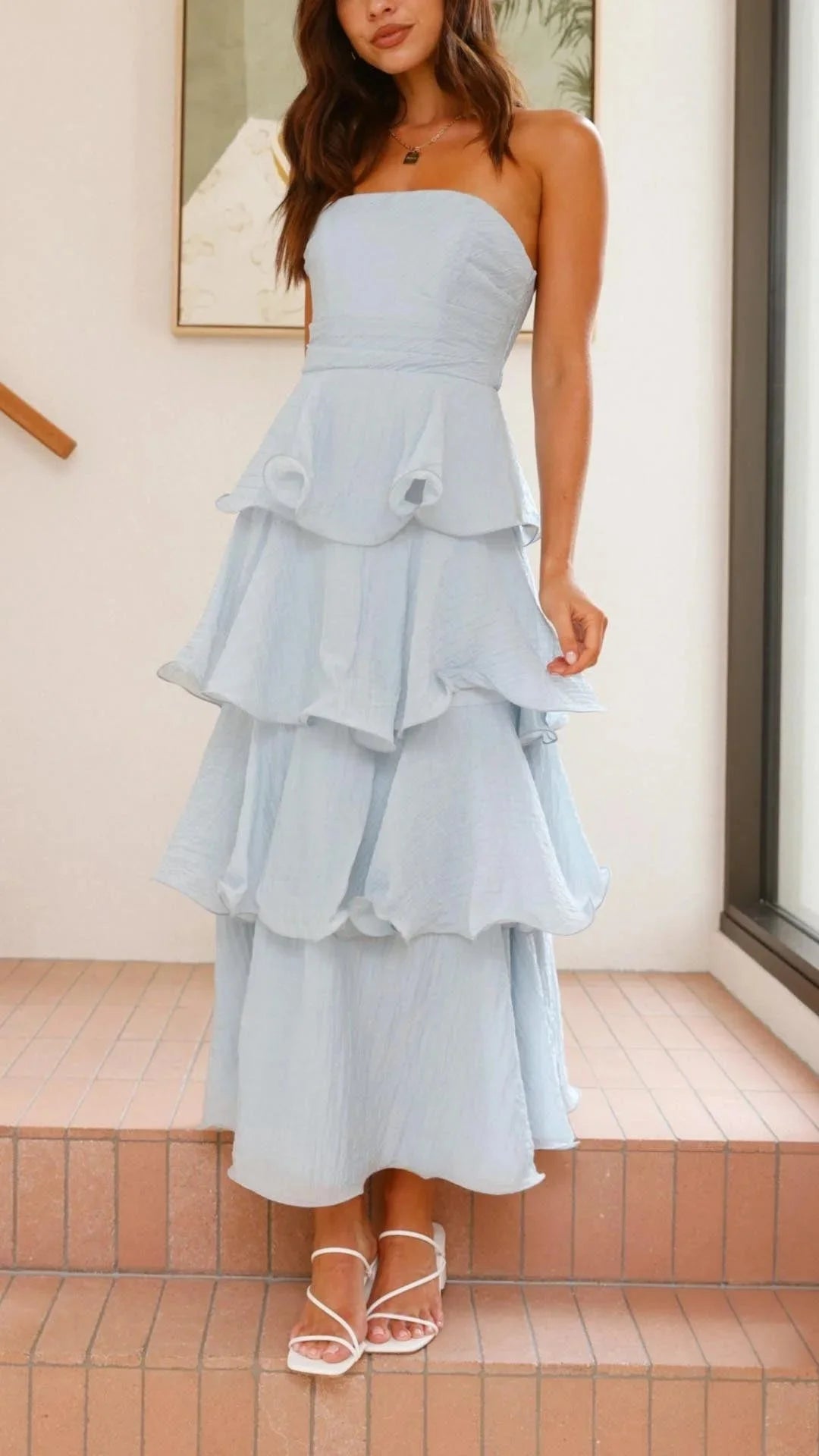 "Strapless tiered maxi dress in breezy fabric with cascading ruffles, perfect for a summer day out"