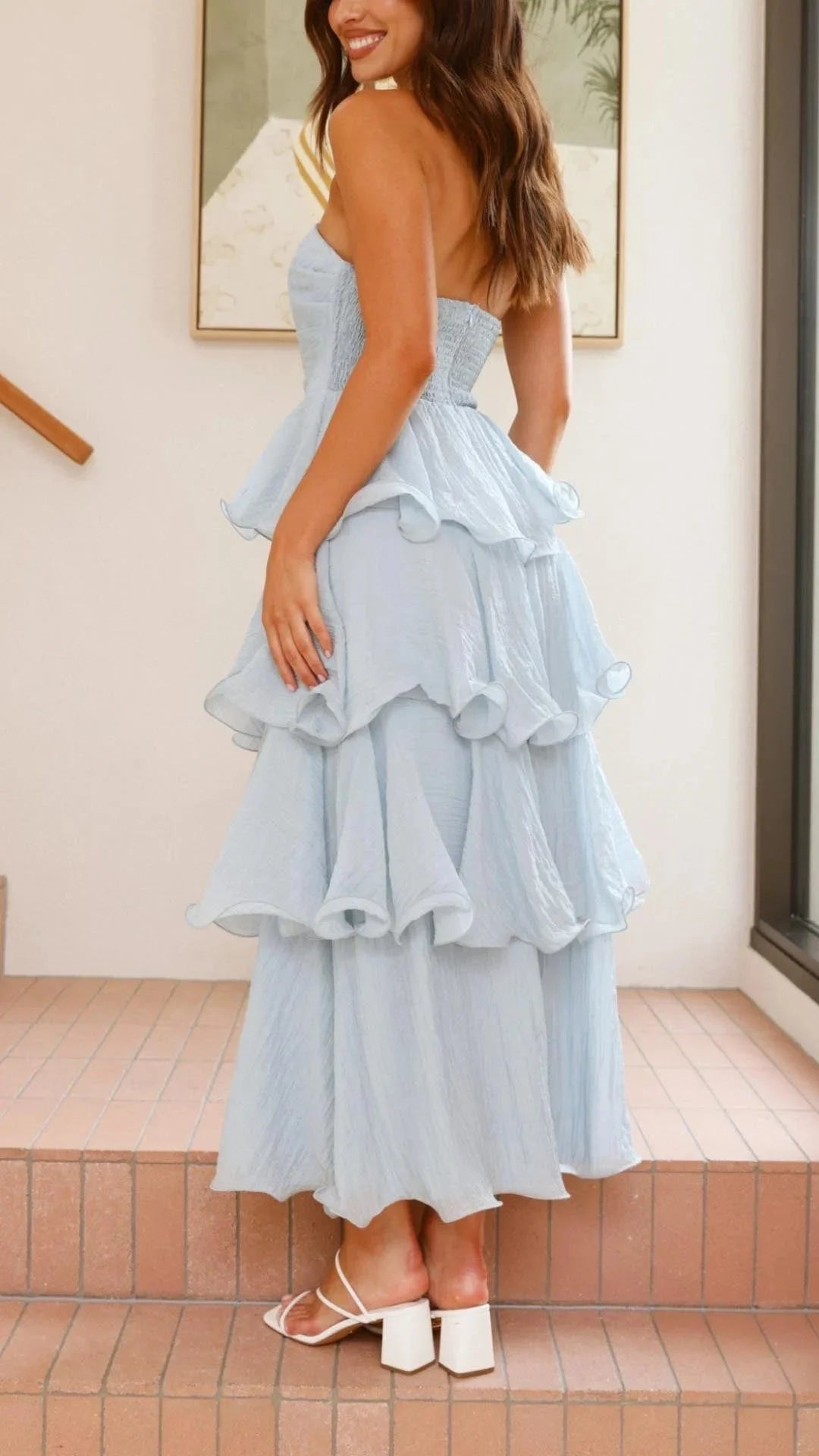 Strapless maxi dress in black with tiered ruffles, perfect for summer in lightweight cotton material.