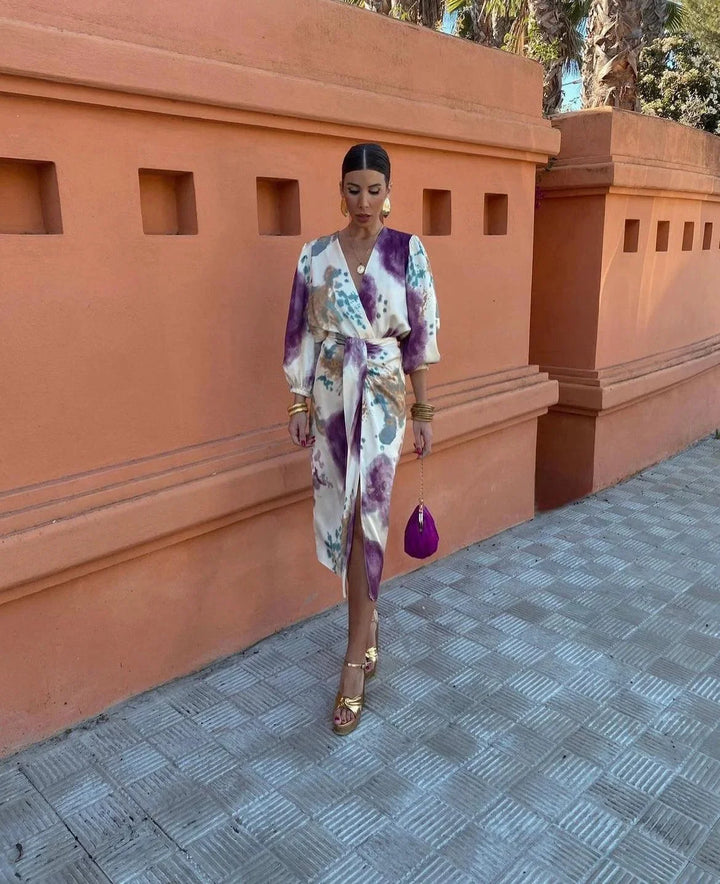 "Women's satin wrap dress with artistic print featuring a vibrant and elegant design for a sophisticated and stylish look."