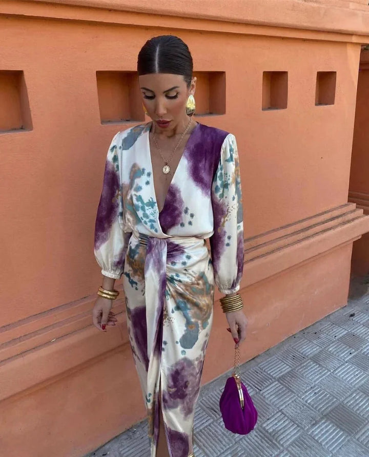 Women's satin wrap dress with artistic print featuring a bold and elegant design, ideal for a special occasion or night out.