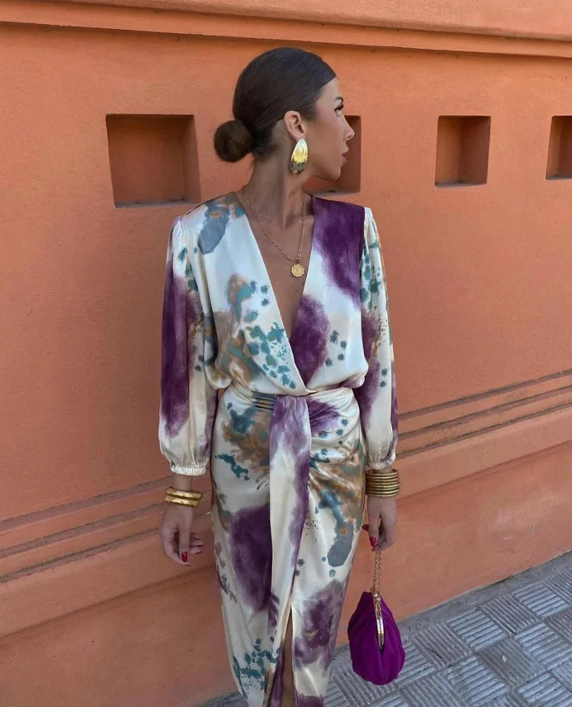 Multicolored satin wrap dress for women with artistic print, stylish and vibrant design ideal for special occasions.