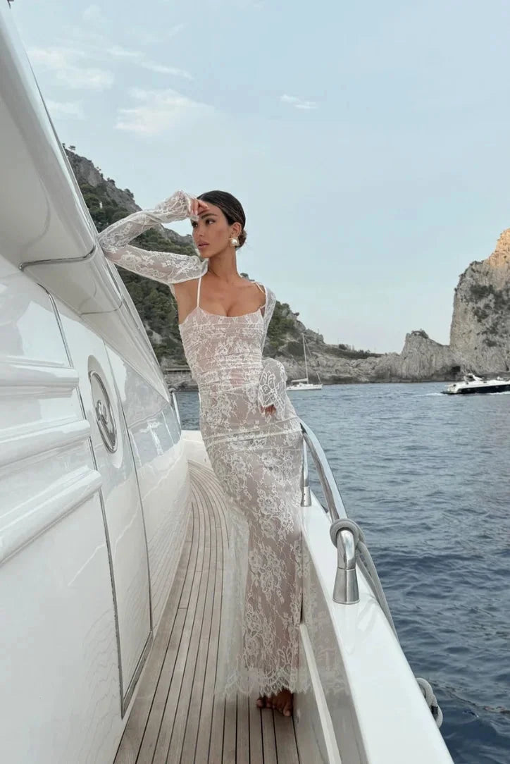 White fitted lace dress with sheer sleeves, delicate floral lace detailing and elegant design, perfect for special occasions.