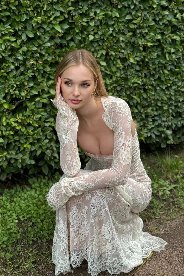 "White fitted lace dress with sheer sleeves, perfect for a chic and elegant look."