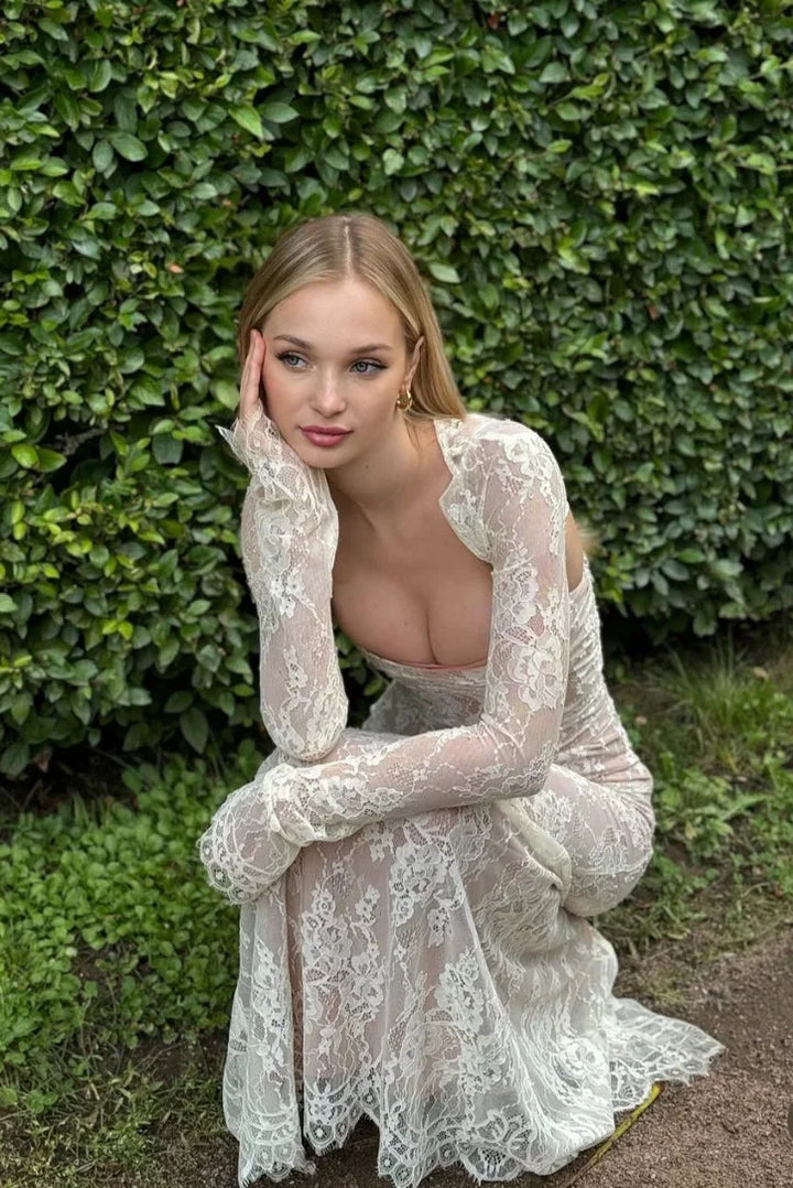 "White fitted lace dress with sheer sleeves, perfect for a chic and elegant look."