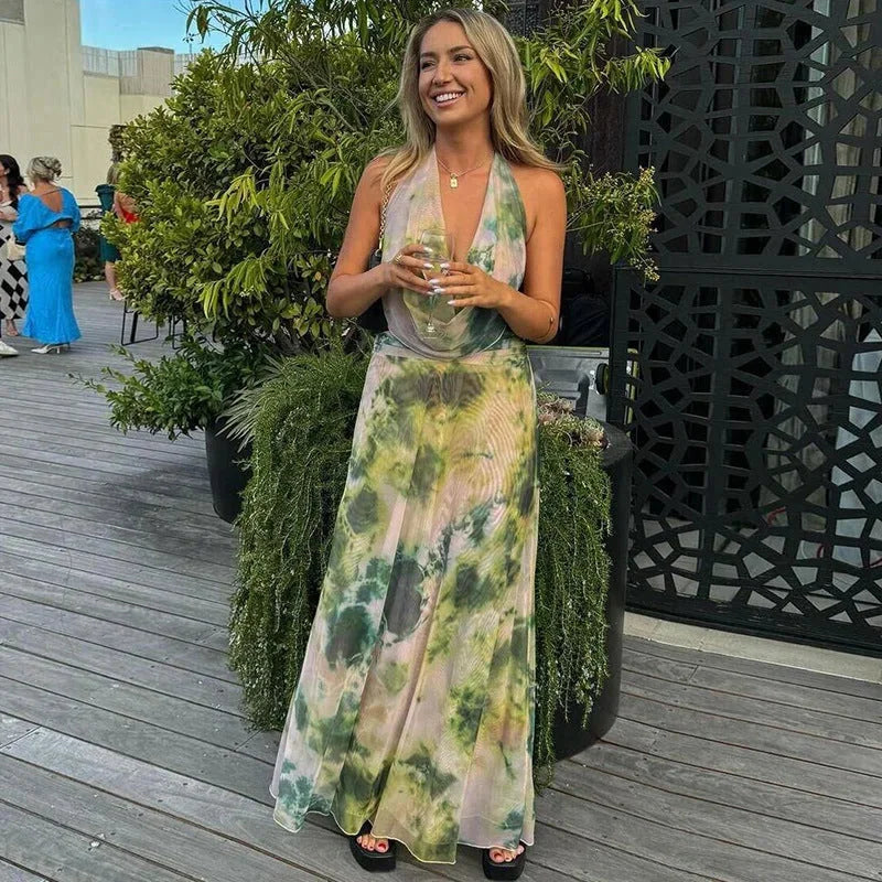 Green tie-dye halter maxi dress, perfect for casual summer days. Made with comfortable and breezy fabric.