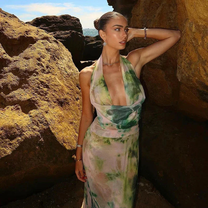Green tie-dye maxi dress with halter neckline, perfect for summer days.
