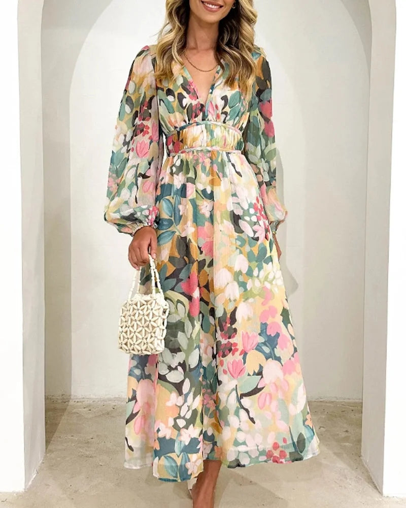 Flowy floral maxi dress in viscose fabric with a waist belt, perfect for a sunny day out or special occasion.