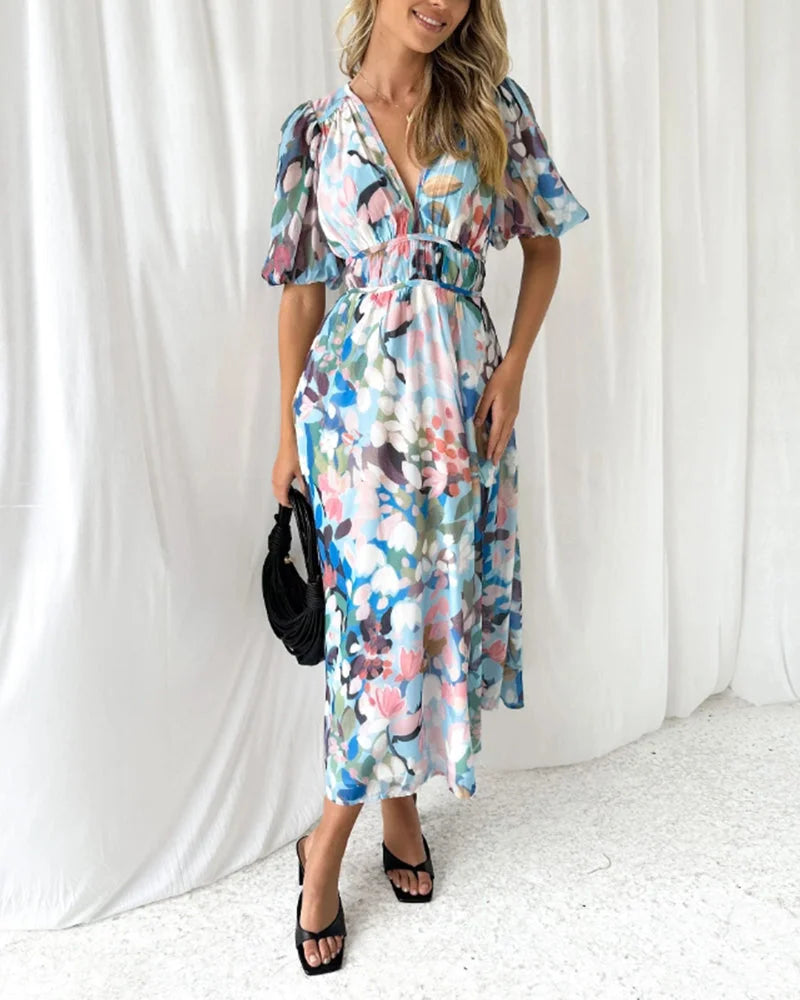 "Flowy floral maxi dress with belt, featuring a charming design of vibrant flowers on a lightweight and airy fabric"