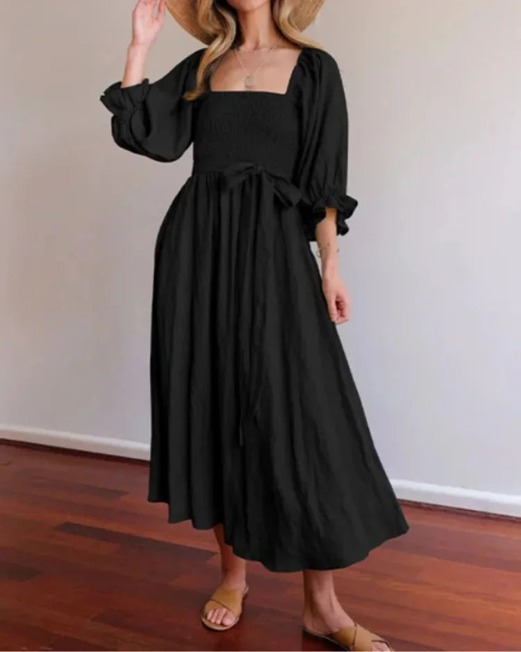 "Black wrap dress with ruched sleeves for women, made of soft breathable fabric, ideal for casual or formal occasions."