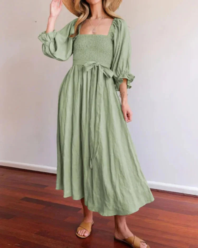 Green wrap dress for women with ruched sleeves. Soft and breathable fabric. Perfect for a casual chic look.