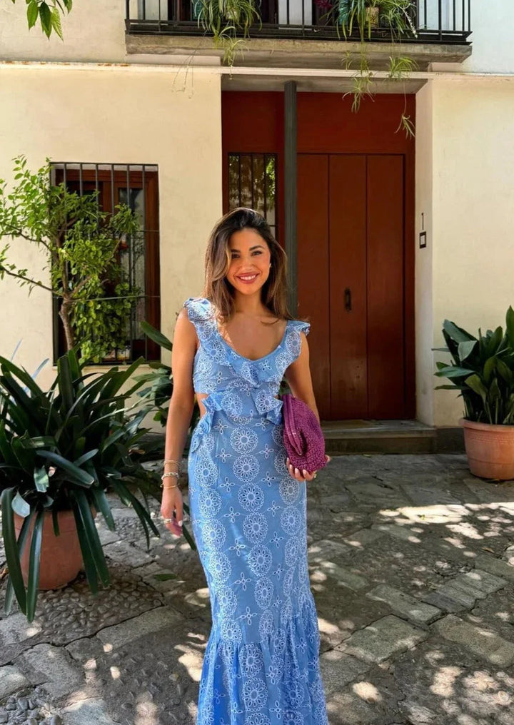 Women’s blue circle patterned ruffle maxi dress in Colour. Features ruffle detailing and unique circle pattern design on…