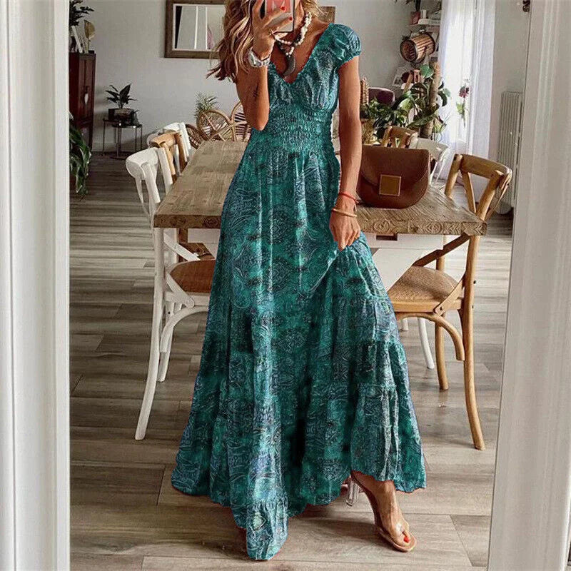 Green V-neck tiered maxi boho dress, featuring flowy design with detailed shirring, perfect for a casual yet chic summer…