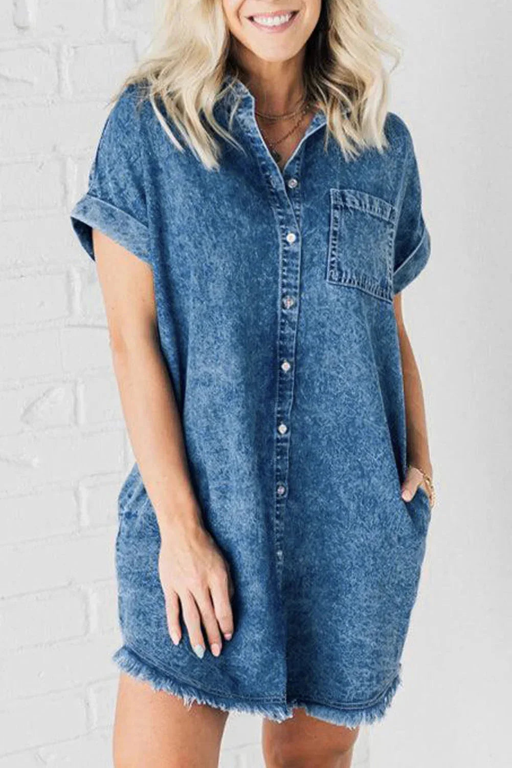 Blue denim dress with frayed hem and pockets, casual yet stylish, perfect for everyday wear or weekend outings.
