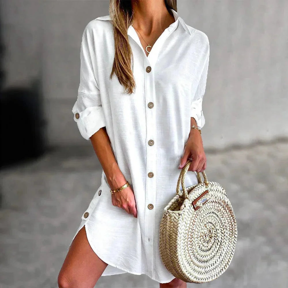 "Women's button-up mini shirt dress in soft cotton blend, featuring pinstripe design with front pockets and waist tie."
