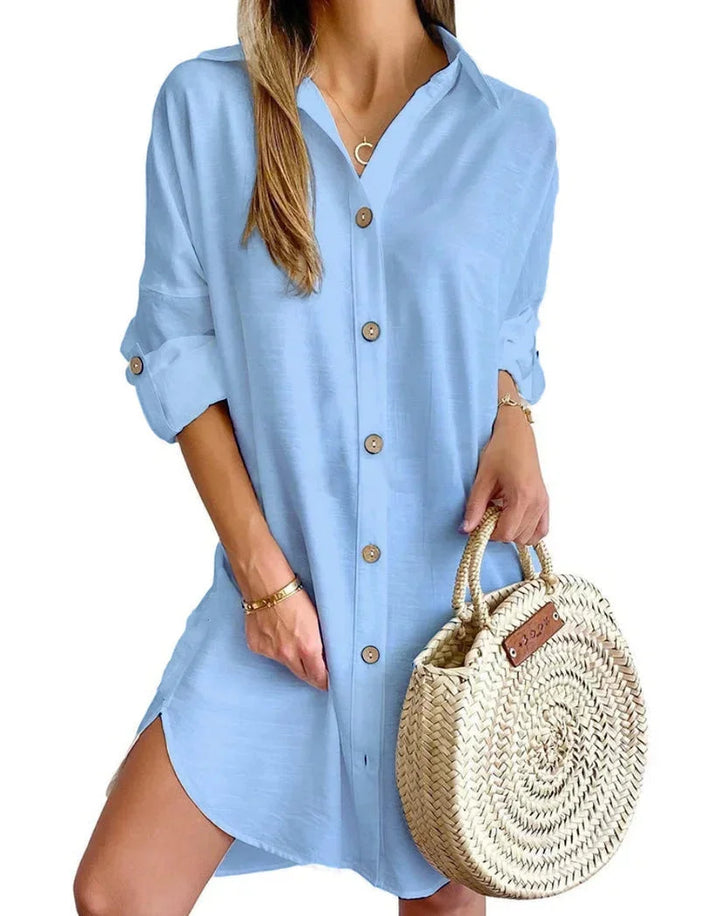 Light blue button-up mini shirt dress for women, made from lightweight fabric with a flattering silhouette and chic collar…