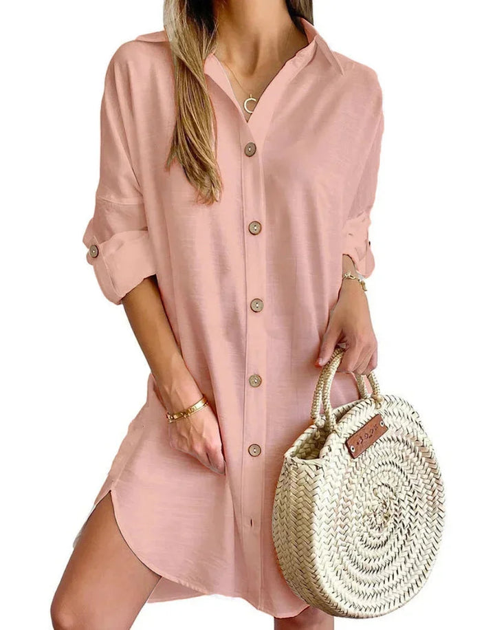 Pink button-up mini shirt dress for women, made from soft cotton blend fabric. Features include collared neckline and…