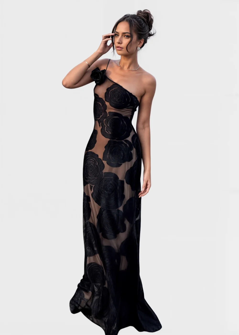 Sheer black maxi dress with delicate floral detail, perfect for a chic and stylish look.