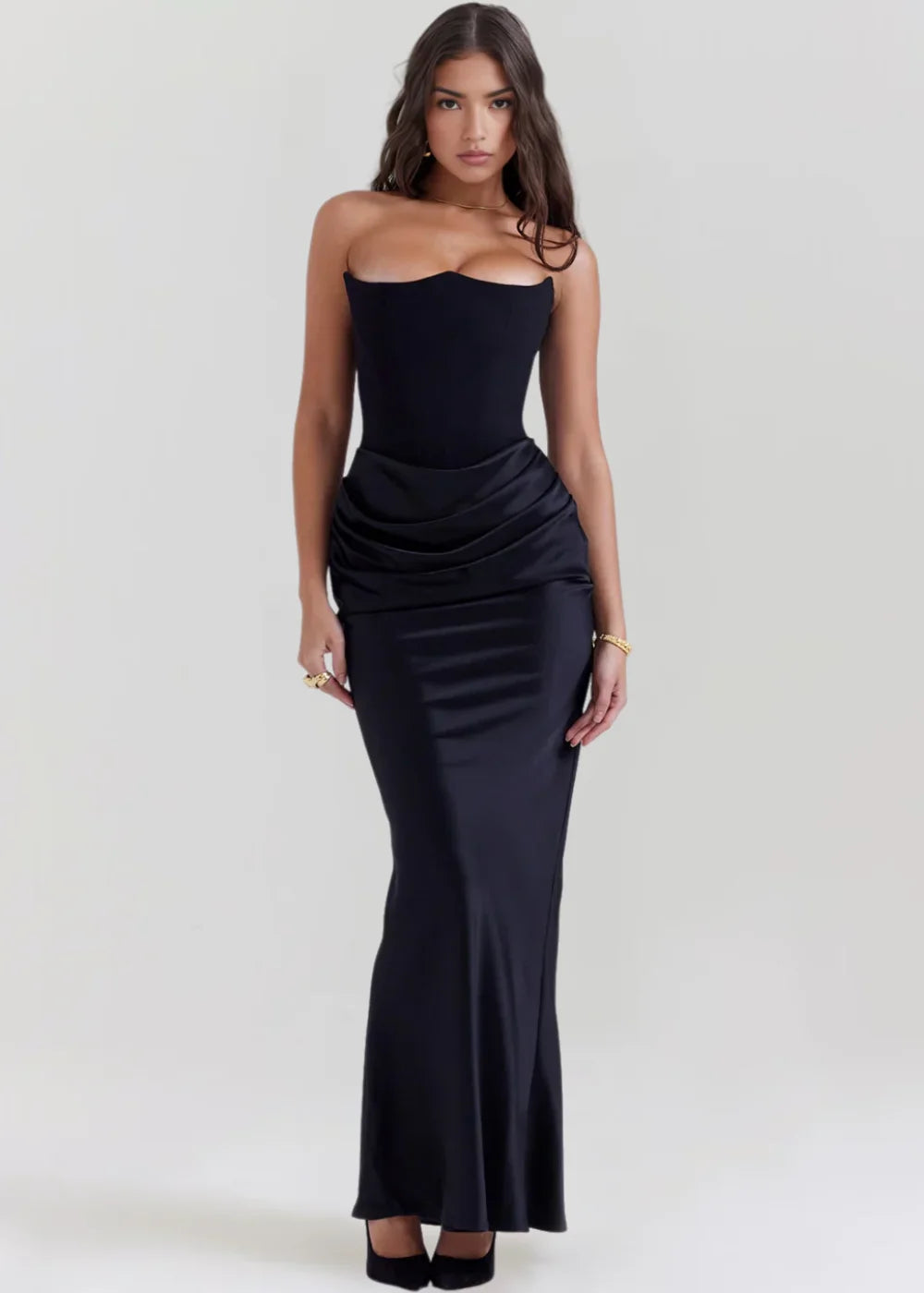 Navy blue draped evening dress with a flowing silhouette and off-shoulder sleeves, perfect for special occasions.