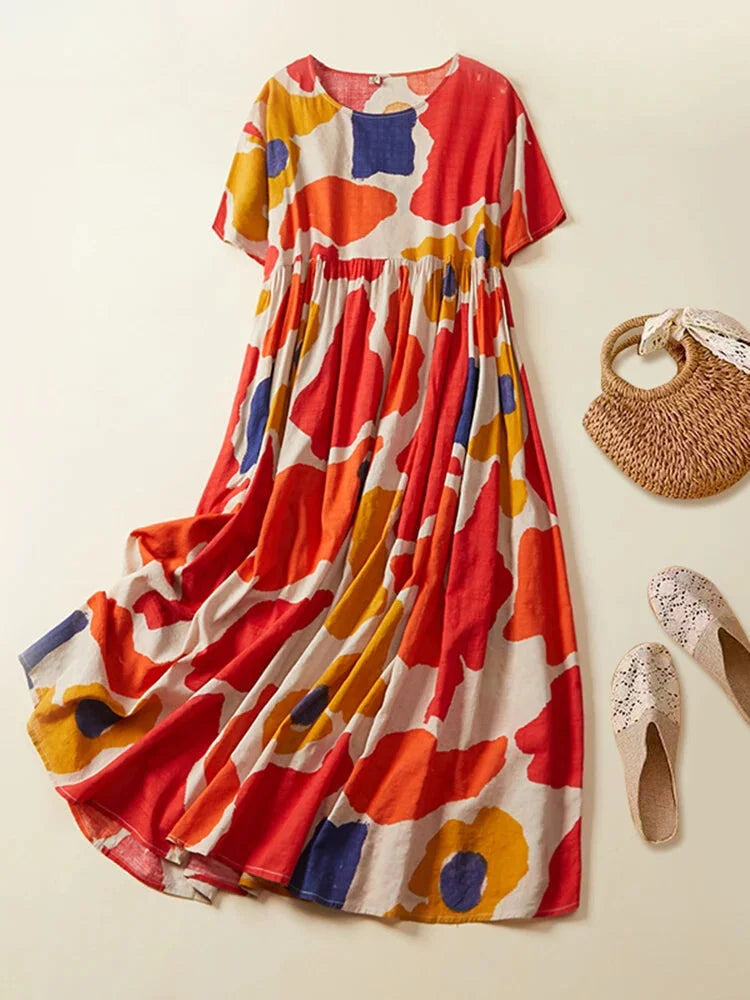 Red flowy abstract-print maxi dress with a comfortable light fabric.