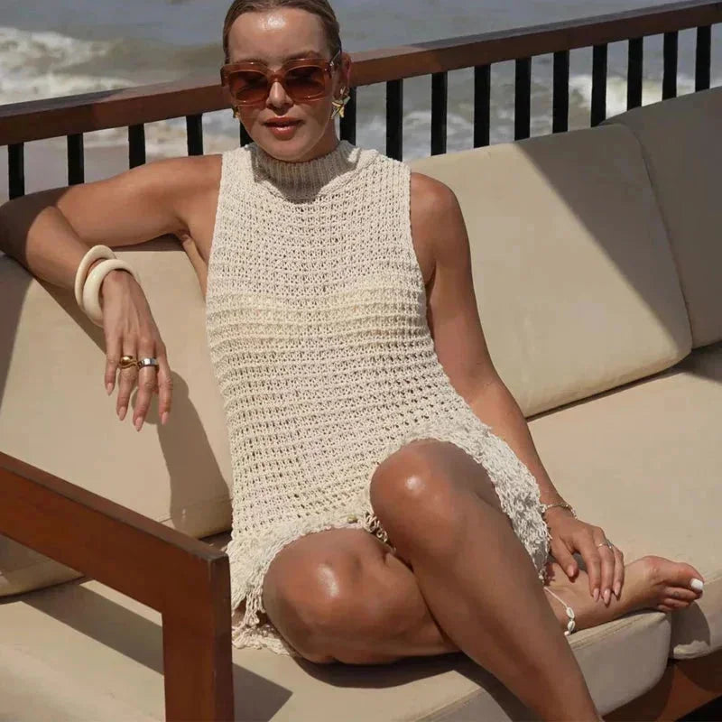 Ivory sleeveless ankle-length dress with tassels made of lightweight flowy fabric, perfect for summer outings and special…